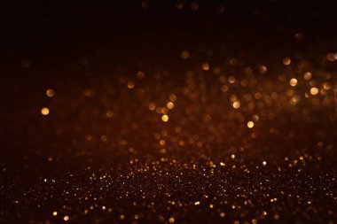 soyut glitter ışıkları arka plan. altın ve siyah. de odaklı