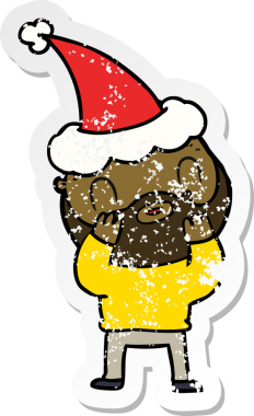 Orijinal el, Noel Baba şapkası takan sakallı bir adamın çizilmiş çıkartması.