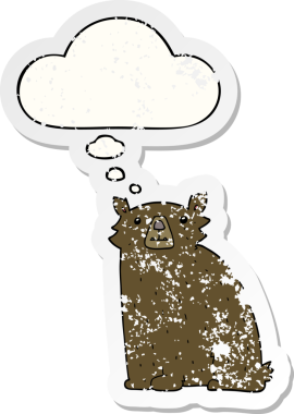 Düşünce baloncuğu olan çizgi film ayısı bir insan tarafından çizilmiş yıpranmış bir çıkartma.