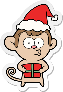 Bir insan tarafından çizilmiş Noel Baba şapkası giyen bir maymunun el yazısı.