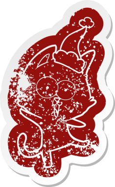 Komik çizgi film ikonu Noel Baba şapkası takan bir kedi bir insan tarafından çizilmiş.