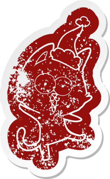 Komik çizgi film ikonu Noel Baba şapkası takan bir kedi bir insan tarafından çizilmiş.