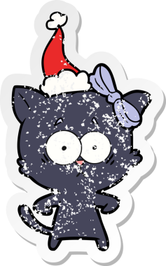 Bir insan tarafından çizilmiş Noel Baba şapkası takan bir kedinin çizilmiş el yazısı.