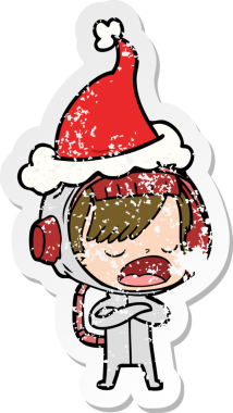 Astronot bir kadının insan tarafından çizilmiş Noel Baba şapkası giydiğini anlatan bir el çizimi karikatür.