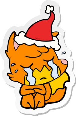 Ağlayan tilki eli bir insan tarafından çizilmiş Noel Baba şapkasının çıkartması.