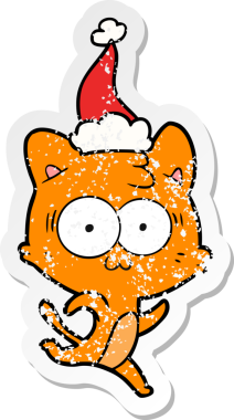 Bir insan tarafından çizilmiş Noel Baba şapkasıyla koşan şaşırmış bir kedinin el yazısı.