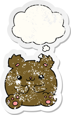 Düşünce baloncuğu olan çizgi film ayısı bir insan tarafından çizilmiş yıpranmış bir çıkartma.