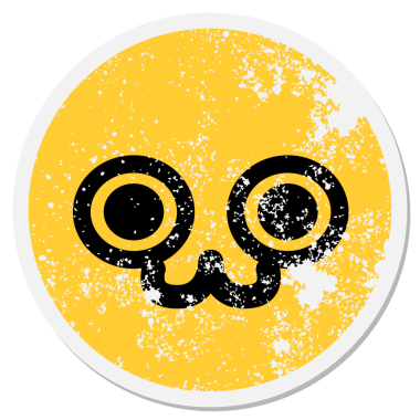 Bir insan tarafından çizilmiş şirin hayvan suratlı dairesel çıkartmaya bakıyordu.