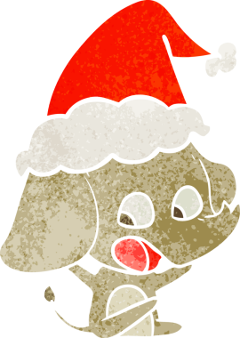 Bir insan tarafından çizilmiş Noel Baba şapkası takan bir fil çizilmiş.