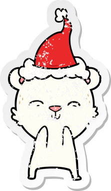 Mutlu el, bir insan tarafından çizilmiş Noel Baba şapkası giymiş bir kutup ayısının kederli çıkartması.