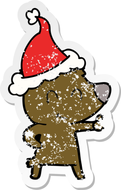 Kadın ayı eli, bir insan tarafından çizilmiş Noel Baba şapkasının çizilmiş çıkartması.