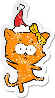 Bir insan tarafından çizilmiş Noel Baba şapkası takan bir kedinin çizilmiş el yazısı.