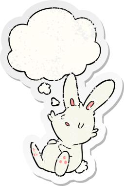 Düşünce baloncuğuyla uyuyan çizgi film tavşanı insan tarafından çizilmiş yıpranmış bir çıkartma gibidir.