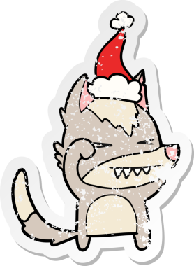 Yorgun kurt eli, bir insan tarafından çizilmiş Noel Baba şapkasının üzgün çıkartmasını çizmiş.