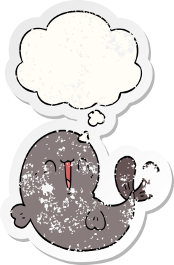 Düşünce baloncuğu olan sevimli çizgi film balinası bir insan tarafından çizilmiş yıpranmış bir çıkartma.