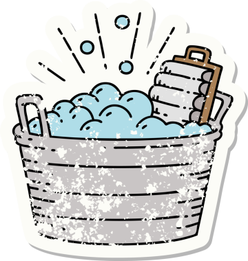 Dövme stili eski bir çıkartma eski bir çamaşır tahtası ve bir insan tarafından çizilmiş fırçalama kabı.