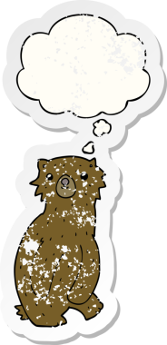 Düşünce baloncuğu olan çizgi film ayısı bir insan tarafından çizilmiş yıpranmış bir çıkartma.