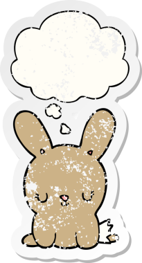 Düşünce baloncuğu olan sevimli çizgi film tavşanı bir insan tarafından çizilmiş yıpranmış bir çıkartma.