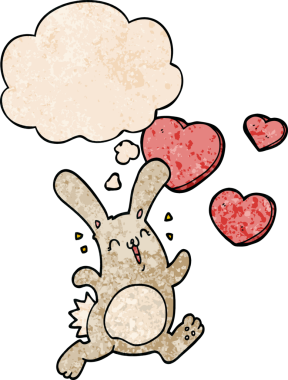 Çizgi film tavşanı, insan tarafından çizilmiş grunge dokusunda düşünce baloncuğuna aşık.