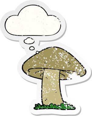 Düşünce baloncuğu olan karikatür mantarı insan tarafından çizilmiş yıpranmış bir çıkartma.