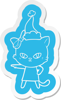 Bir insan tarafından çizilmiş Noel Baba şapkası giyen bir kedinin komik çizgi film çıkartması.