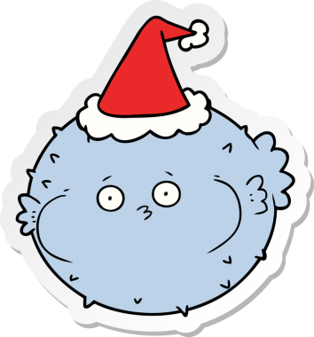 Bir insan tarafından çizilmiş Noel Baba şapkası takan kirpi balığının el yazısı.