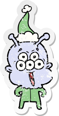 Mutlu el, bir insan tarafından çizilmiş Noel Baba şapkası giymiş bir uzaylının kederli çıkartması.