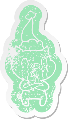 Ağlayan domuz çizgi filmi bir insan tarafından çizilmiş Noel Baba şapkasının çıkartması.