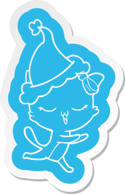 Kafasında fiyonk olan bir kedinin insan tarafından çizilmiş Noel Baba şapkası.