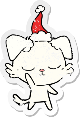 Bir insan tarafından çizilmiş Noel Baba şapkası takan bir köpeğin üzgün çıkartması çizilmiş şirin bir el.