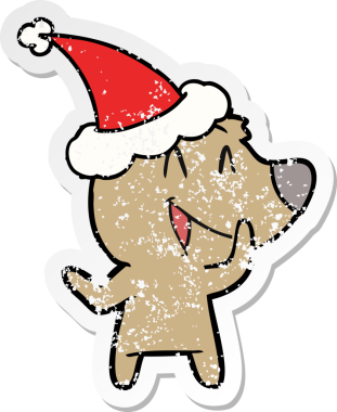 Gülen ayı eli, bir insan tarafından çizilmiş Noel Baba şapkasının sıkıntılı çıkartmasını çizmiş.