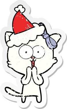 Bir insan tarafından çizilmiş Noel Baba şapkası takan bir kedinin çizilmiş el yazısı.