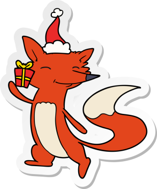 Bir insan tarafından çizilmiş Noel Baba şapkası giyen mutlu bir tilkinin el yazısı.