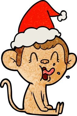 Bir insan tarafından çizilmiş Noel Baba şapkası giymiş bir maymunun desenli çizimi.