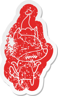 Garip çizgi film, bir insanın çizdiği Noel Baba şapkasını takan dişlerini gösteren bir kurt çıkartması.