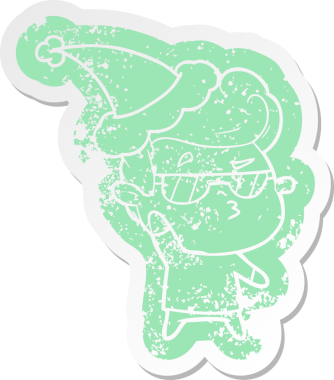 Garip bir çizgi film, Noel Baba şapkası takan havalı bir adamın insan tarafından çizilmiş çıkartması.