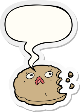 Bir insan tarafından çizilmiş konuşma balonu çıkartmalı ısırılmış çizgi film kurabiyesi.