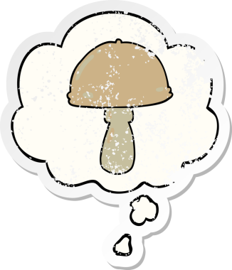 Düşünce baloncuğu olan karikatür mantarı insan tarafından çizilmiş yıpranmış bir çıkartma.