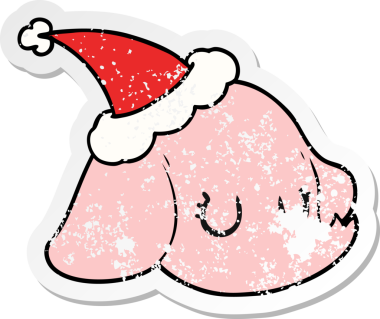 Bir insan tarafından çizilmiş Noel Baba şapkası giymiş fil suratlı bir el yazısı.