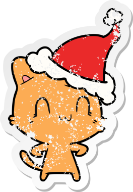 Bir insan tarafından çizilmiş Noel Baba şapkası takan mutlu bir kedinin çizilmiş el yazısı.