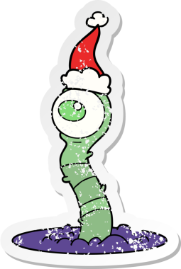 Bir insan tarafından çizilmiş Noel Baba şapkası giyen uzaylı bir bataklık canavarı çizilmiş.