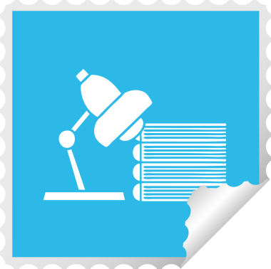 Bir insan tarafından çizilmiş ders kitabı ve lambanın kare soyma etiketi.