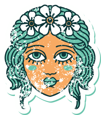 Bir insan tarafından çizilmiş çiçek desenli kadın yüzünün sembolik dövmesi.