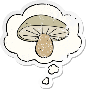 Düşünce baloncuğu olan karikatür mantarı insan tarafından çizilmiş yıpranmış bir çıkartma.