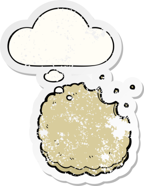 Düşünce baloncuklu çizgi film bisküvisi insan tarafından çizilmiş yıpranmış bir çıkartma.