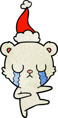 Ağlayan kutup ayısı eli bir insan tarafından çizilmiş Noel Baba şapkası.