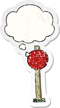 Düşünce baloncuğu olan çizgi film levhası bir insan tarafından çizilmiş yıpranmış bir çıkartma.