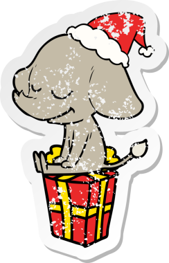 Bir insan tarafından çizilmiş Noel Baba şapkası giymiş gülümseyen bir filin kederli çıkartması.