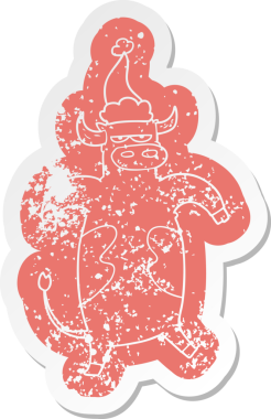 Bir insan tarafından çizilmiş Noel Baba şapkası takan bir boğanın garip karikatürü.