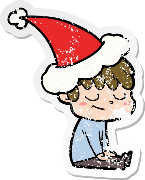 Bir insan tarafından çizilmiş Noel Baba şapkası giymiş mutlu bir çocuğun el çizimi çıkartması.